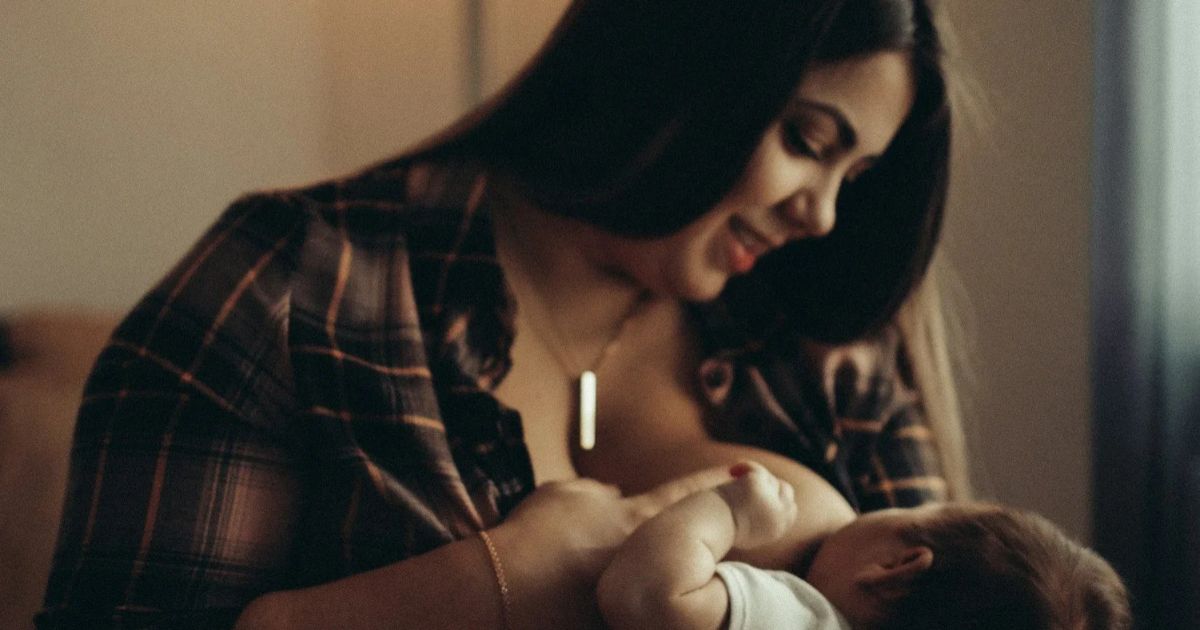 woman breastfeeding baby