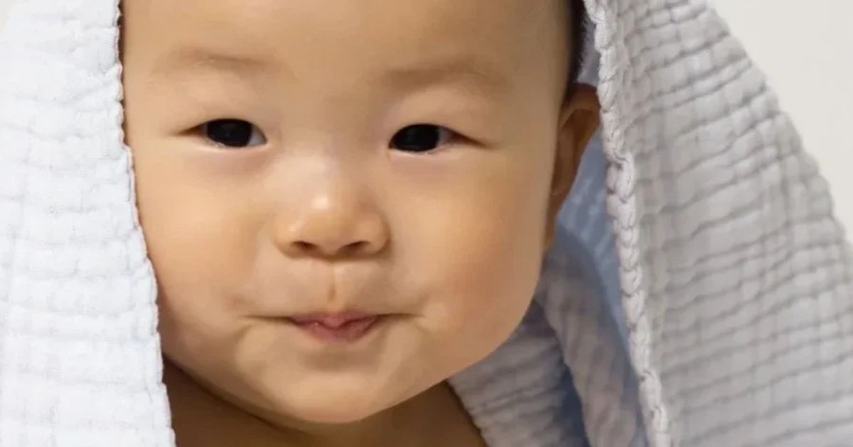 baby after bath in white towel