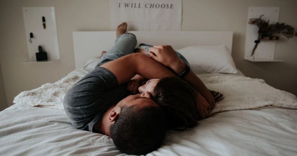 couple embracing in bed