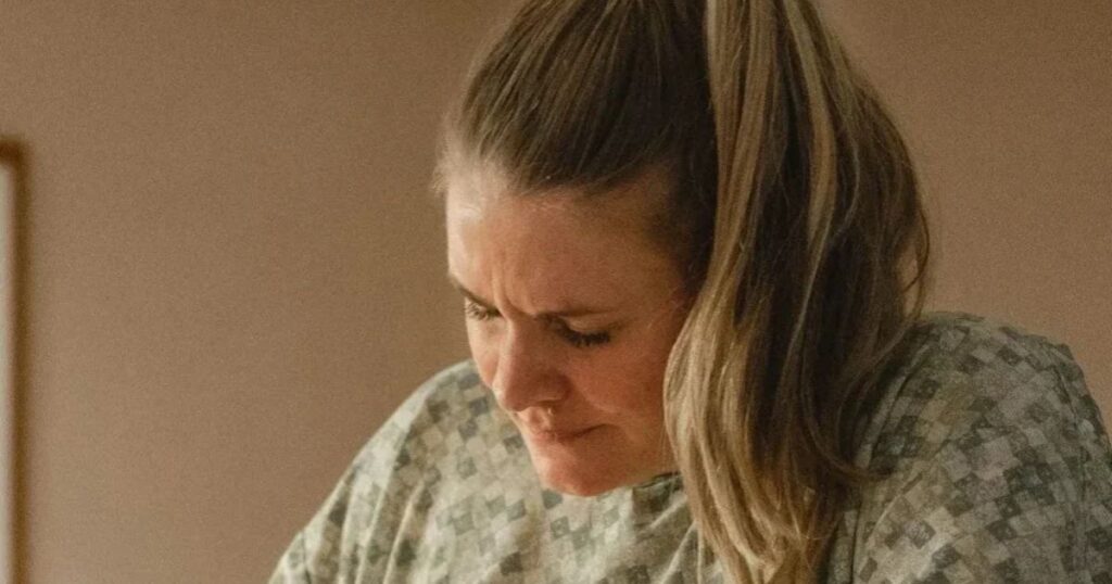 woman in labor in hospital gown