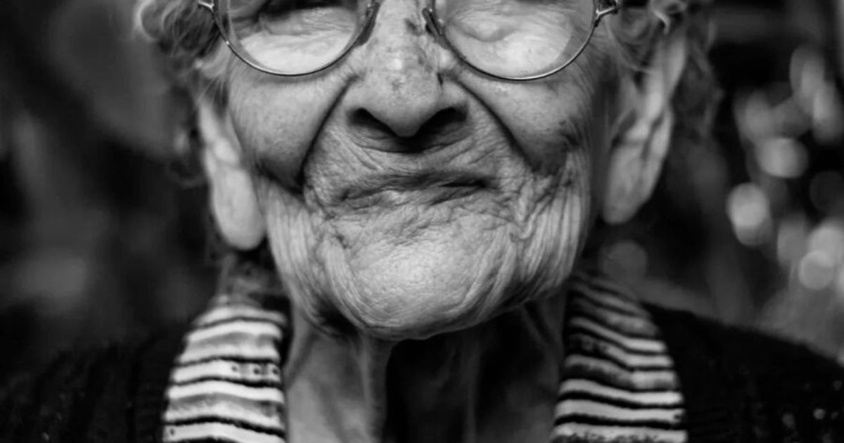 elderly woman in glasses
